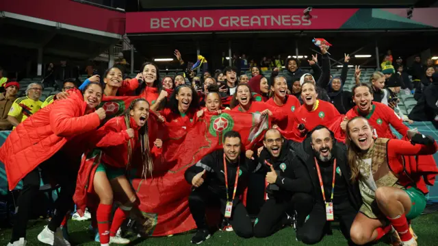 Morocco celebrate qualifying from the group stage