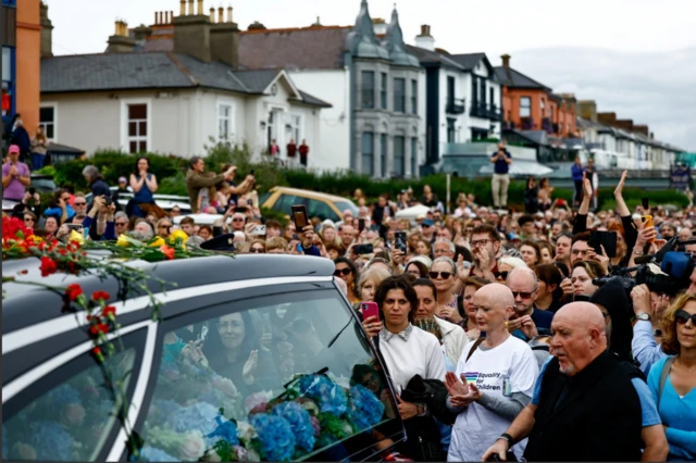 Mourners near the former home of Sinead O'Connor in Bray