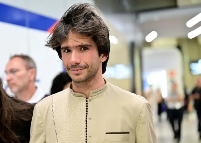 French-Spanish lawyer Juan Branco arrives at Roissy-Charles-de-Gaulle airport, outside Paris, after he was placed under judicial supervision and expelled from Senegal.