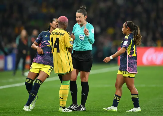Blackwood remonstrates with the ref as Colombia players ask for a booking.