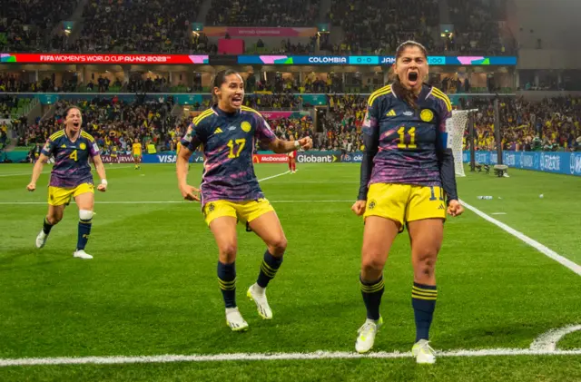 Usme celebrates at the corner flag after scoring.