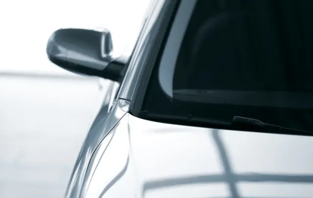 A stock photo of a car with a tinted window