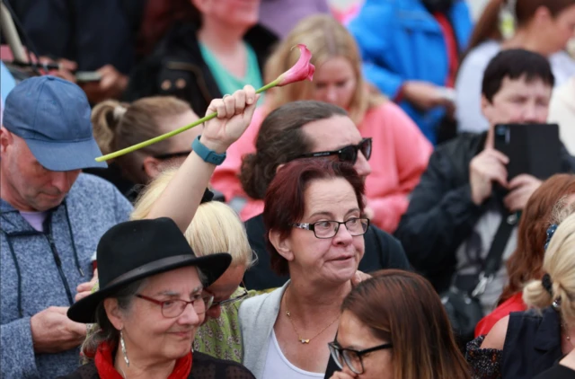 Mourner with flower in Bray