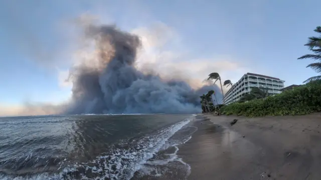 Some billows behind a building on a beach