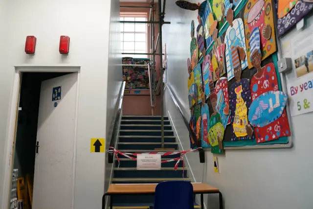 Stairs in a school are taped off due to an RAAC ceiling