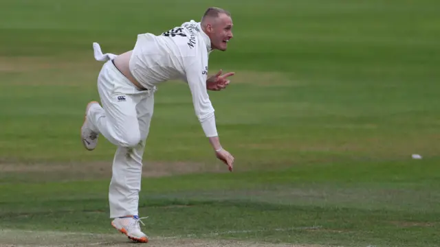 Matt Parkinson bowling for Durham