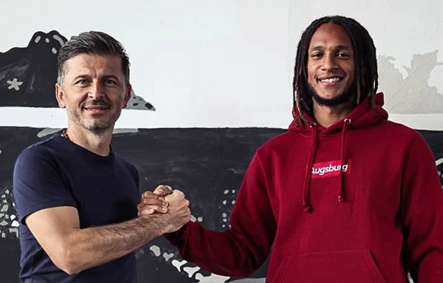 Marinko Jurendic (FCA sporting director) and Kevin Mbabu shake hands