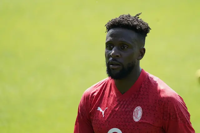 Dicok Origi looks on during training