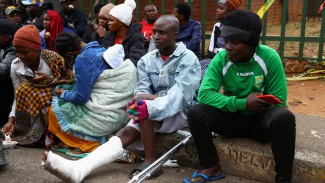 Tom Mandala, a survivor, looks on next to the scene of a deadly blaze in Johannesburg, South Africa, September 1, 2023