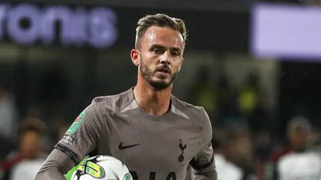 James Maddison jogs to the corner with the ball in his hands