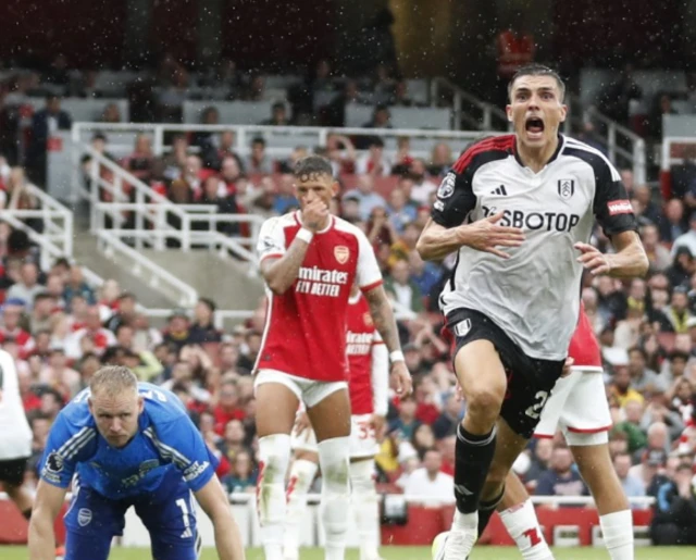 João Palhinha celebrating after scoring past Aaron Ramsdale