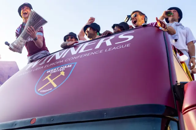 Declan Rice with the Europa Conference League trophy on the bus during the club's homecoming parade