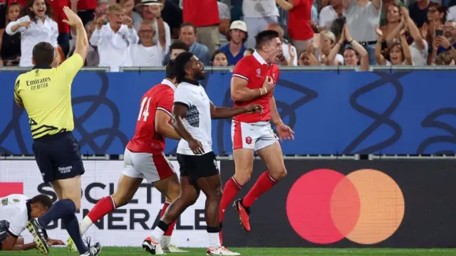 Josh Adams celebrates his try