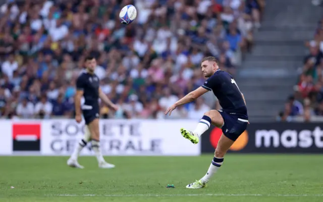 Finn Russell kicks a penalty to make it 6-3 at half-time