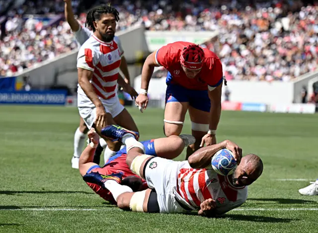 Michael Leitch of Japan scores his team's fourth try