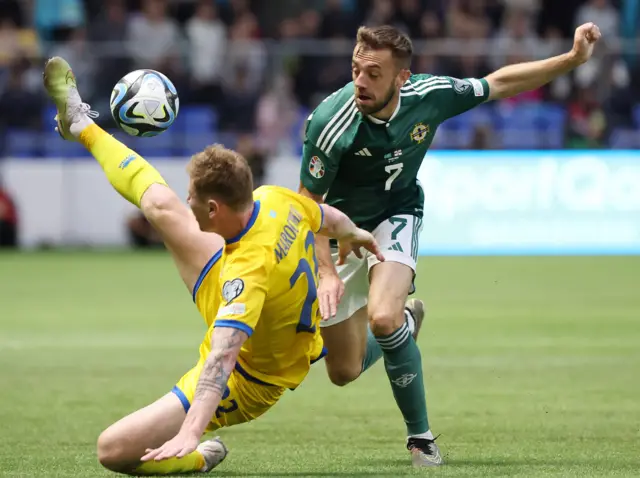 Kazakhstan's Alexandr Marochkin with Northern Ireland's Conor McMenamin