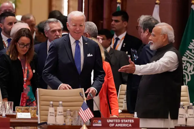 US President Joe Biden (C) and Indian Prime Minister Narendra Modi (R) arrive for the first session of the G20 Leaders' Summit in New Delhi on September 9, 2023