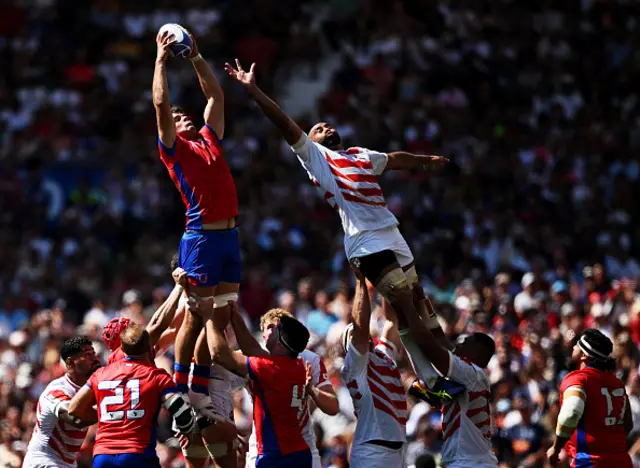 Santiago Pedrero of Chile wins the line out ahead of Michael Leitch