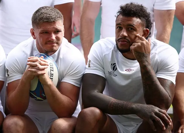 Owen Farrell and Courtney Lawes sit next to each other in a team photo