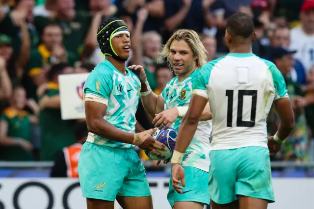 Kurt-Lee Arendse of South Africa celebrates scoring his sides second try with team mates Faf de Klerk and Manie Libbok