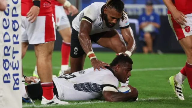 Josua Tuisova scores Fiji's third try