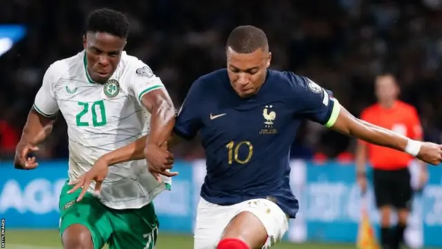 Chiedozie Ogbene and France star Kylian Mbappe tussle for the ball in Thursday's match in Paris