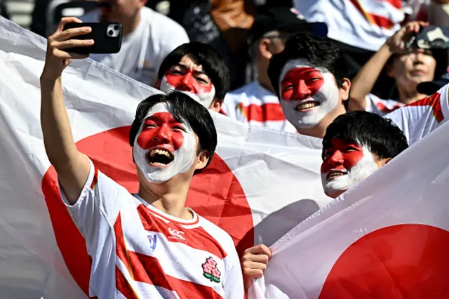 Japan fans take a selfie in the stands