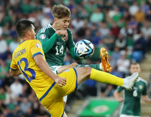 Northern Ireland's Isaac Price with Kazakhstans Lev Skvortsov.