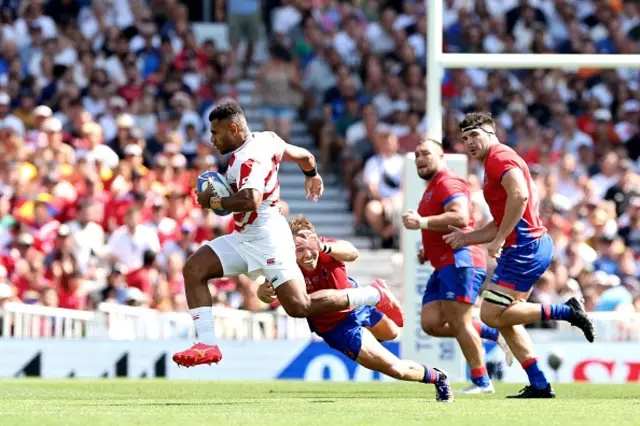 Jone Naikabula is tackled by Chile's outside centre Domingo Saavedra