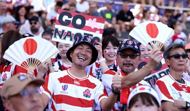 Japan fans smile for the picture in the stand