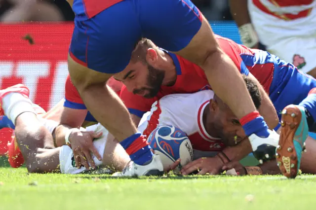 Japan's winger Jone Naikabula crosses the line to score Japan's second try