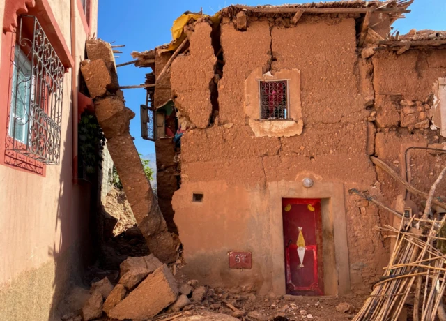 A damaged house in Tansgharte village