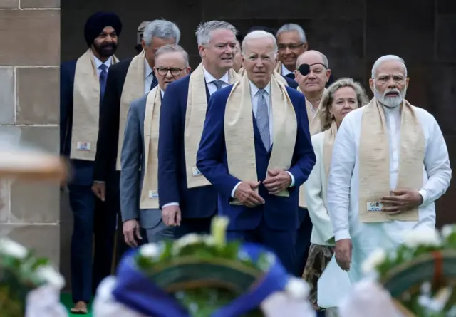 India's Prime Minister Narendra Modi (R), US President Joe Biden (C), German Chancellor Olaf Scholz (3R) and Australia's Prime Minister Anthony Albanese (3L) along with world leaders arrive to pay respect at the Mahatma Gandhi memorial on September 10, 2023.