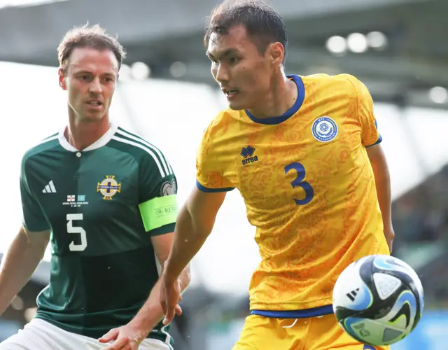 Northern Ireland's Jonny Evans with Kazakhstans Nuraly Alip.