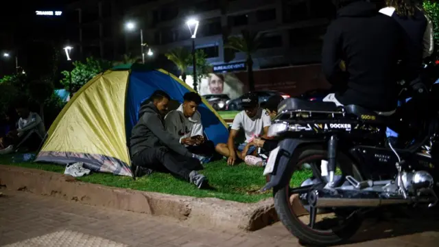 A group of young men sit in a tent in Marrakesh