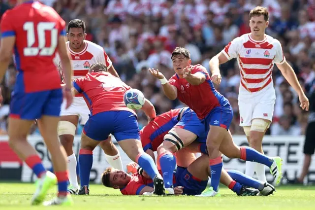 Scrum-half Marcelo Torrealba passes the ball out from a ruck