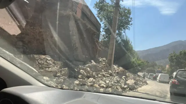 Rubble and leaning telegraph pole in Ourigane, Morocco