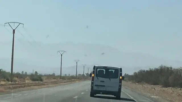 Van on road towards Atlas Mountains