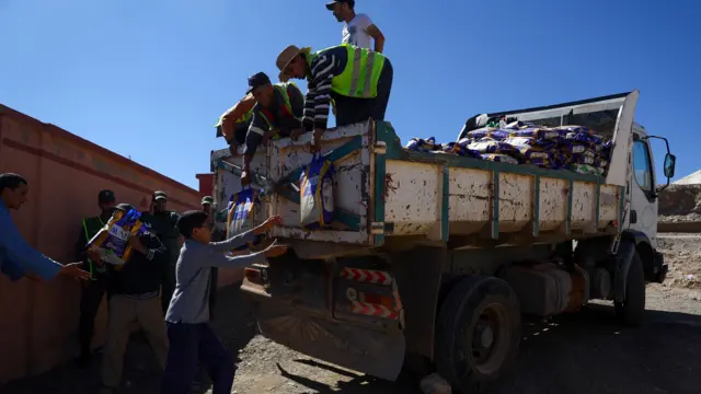 People deliver aid, in the aftermath of a deadly earthquake in Moulay Brahim, Morocco, September 10, 2023.