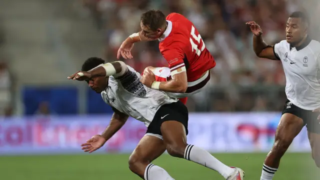 Liam Williams of Wales is tackled by Vinaya Habosi of Fiji