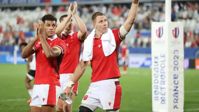 Rio Dyer and Liam Williams salute the Wales fans