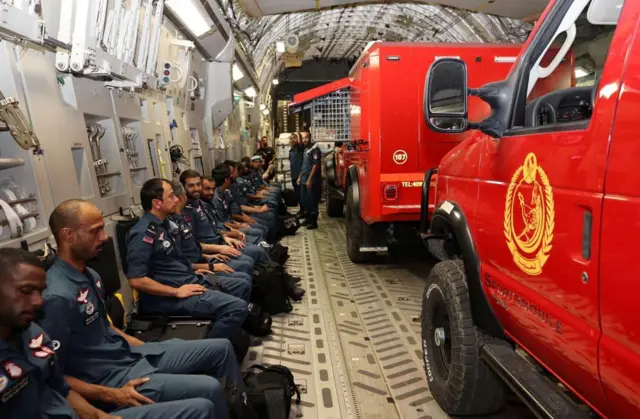 Qatari rescuers on a transport plane heading for Morocco, 10 September 2023