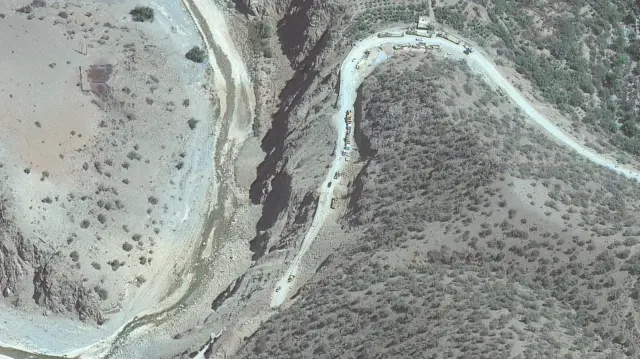 A satellite image shows a road blocked by a landslide, in Amsguine