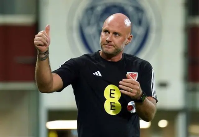 Wales boss Robert Page acknowledges the Red Wall in Latvia