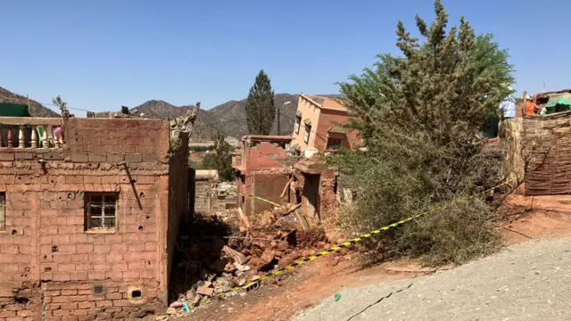 Damaged houses in village of Ourigane