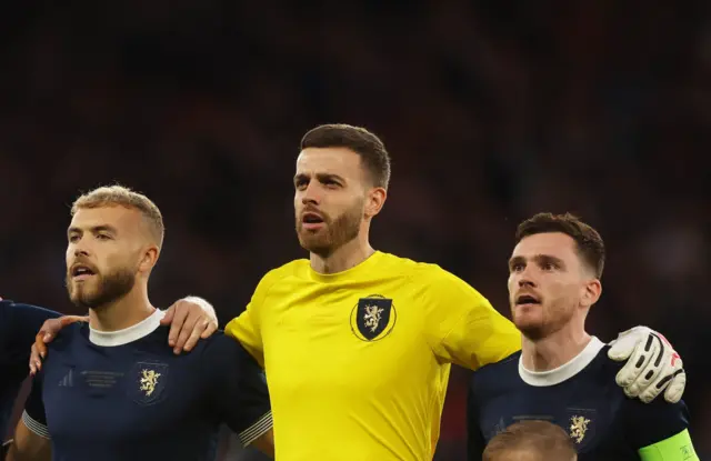 Ryan Porteous, Angus Gunn and Andy Robertson during the national anthem