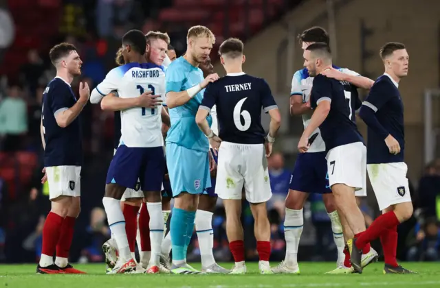 Players exchange handshakes at full-time