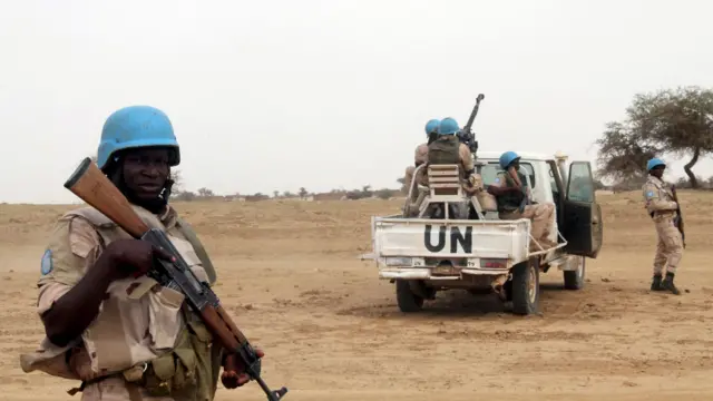 UN peacekeepers stand guard in the northern town of Kouroume, Mali, May 13, 2015. Kourome is 18 km (11 miles) south of Timbuktu.