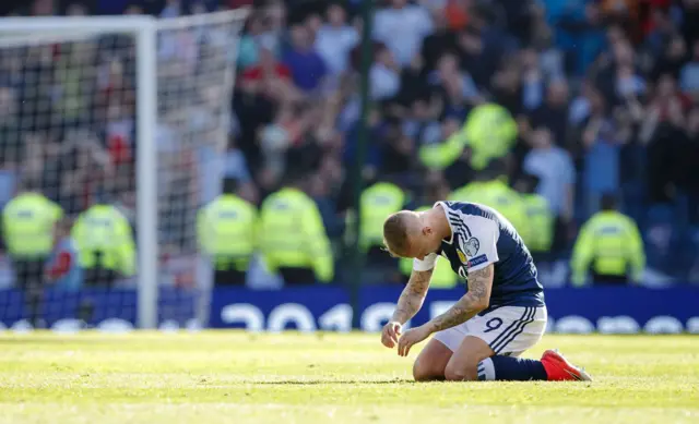 Leigh Griffiths slumps to the turf at full-time