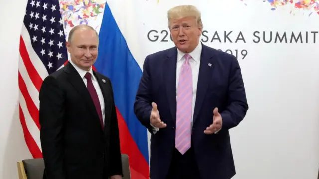 Russia's President Vladimir Putin and US President Donald Trump attend a meeting on the sidelines of the G20 summit in Osaka, Japan in 2019